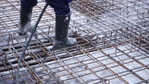 Builders make reinforcement mesh Stock Footage 163566902