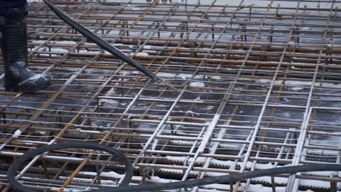 Builders make reinforcement mesh Stock Footage 163566904
