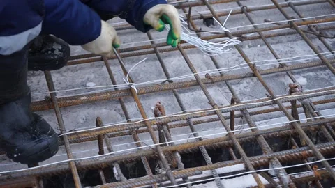 Builders make reinforcement mesh Stock Footage 163566921