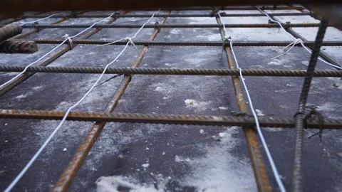 Builders make reinforcement mesh Stock Footage 163566927
