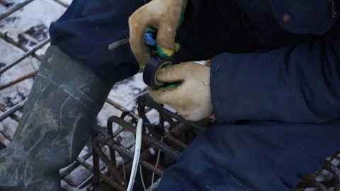 Builders make reinforcement mesh Stock Footage 163566930