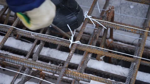Builders make reinforcement mesh Stock Footage 163566935