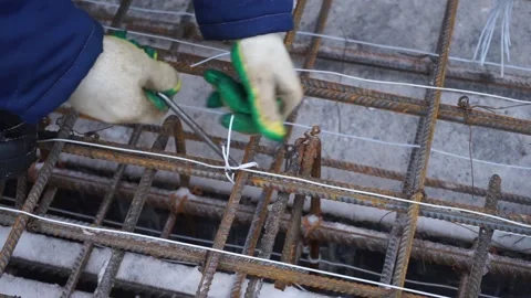 Builders make reinforcement mesh Stock Footage 163566937