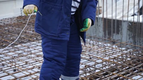 Builders make reinforcement mesh Stock Footage 163566938