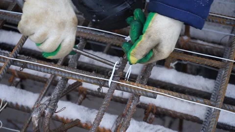 Builders make reinforcement mesh Stock Footage 163566939