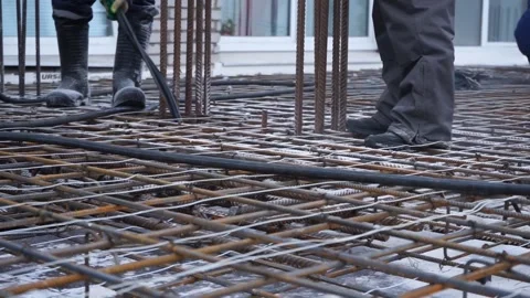 Builders make reinforcement mesh Stock Footage 163566989