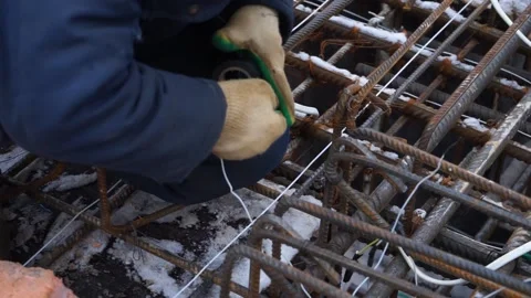 Builders make reinforcement mesh Stock Footage 163566996