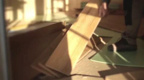 Builders man Install in construction house Laying Laminate Floor Stock Footage 47566747