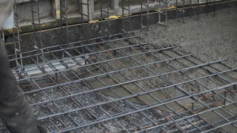 Builders pour concrete at a construction site Stock Footage 283821141