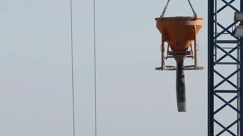 Builders pour concrete crane pump, industrial building on construction site Stock Footage 81484890