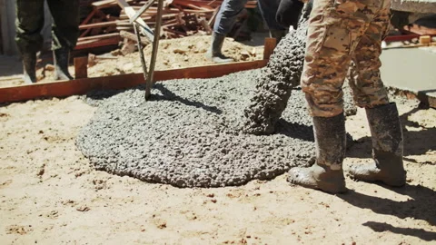 Builders pour concrete into the foundation Stock Footage 292533050