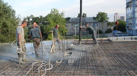 Builders, pouring the concrete, floor slabs. Stock Footage 63392393