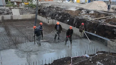 Builders, pouring the concrete, floor slabs. Stock Footage 63392410