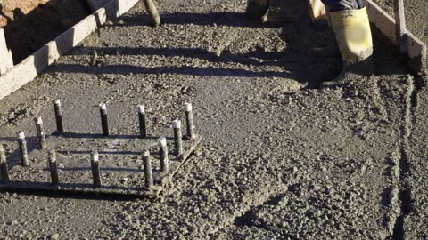 Builders pouring concrete. Stock Footage 310879795
