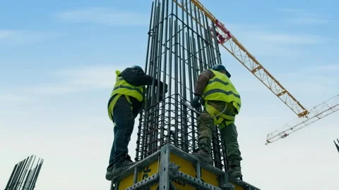 Builders prepare a column for a future home, observing all safety regulations Stock Footage 329547969