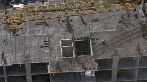 Builders Puts The Slab Formwork on Unfinished Building Construction Site Stock Footage 98595792
