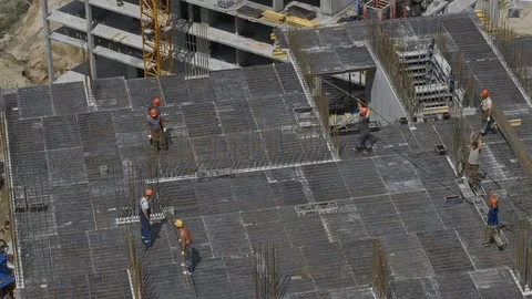 Builders Puts The Slab Formwork on Unfinished Building Construction Site Stock Footage 98698201