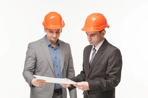 Builders reading drawings Stock Photos