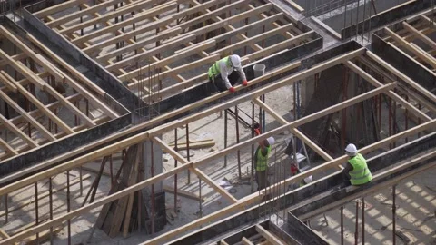 Builders reinforce formwork on construction site Stock Footage 168580539