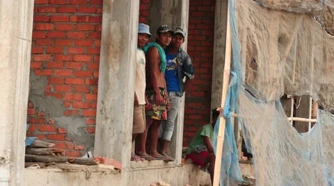 Builders at rest time in Yangon posing - Myanmar house building Stock Footage 61450006