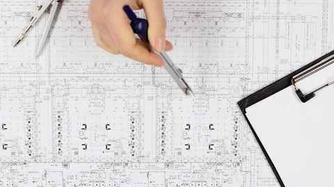 Builders solve questions on the correctness of the drawing. Close up Stock Footage 73676897