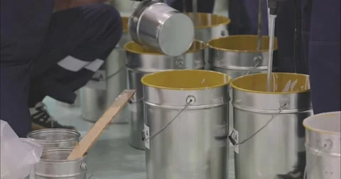 Builders stir materials in buckets. Workers use mixers to stir the material Stock Footage 274467824