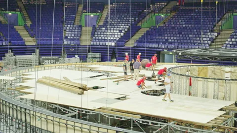 Builders team work with plywood on large swimpool carcass Stock Footage 238936139