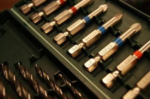 Builder's tools. New set of drill bits and drills, close-up. Stock Photos