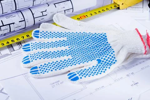 Builder's tools on the scheme of the house. Preparing to build a house. Builder Stock Photos