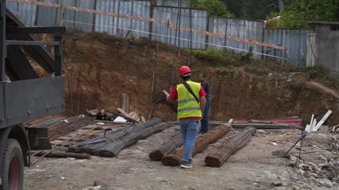 Builders unload building materials Stock Footage 197156740