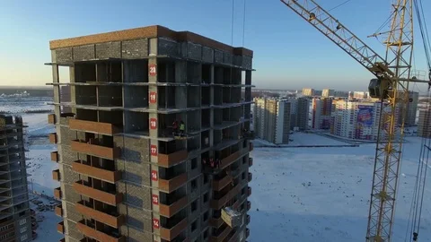 Builders work with a crane Stock Footage 81963674