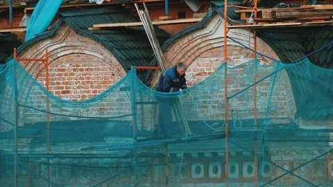 Builders work dangerously without insurance. Stock Footage 116022249
