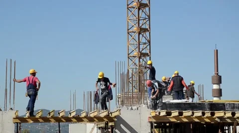 Builders, workers at construction site Stock Footage 67996572