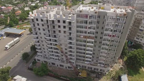 Builders working at construction building site. Aerial view Stock Footage 157054861