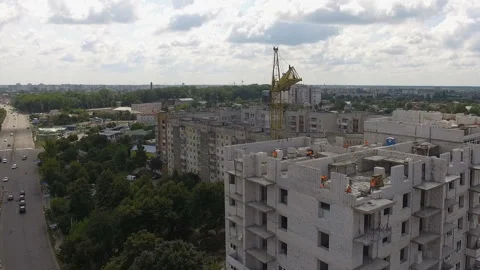 Builders working at construction building site. Aerial view Stock Footage 158791316