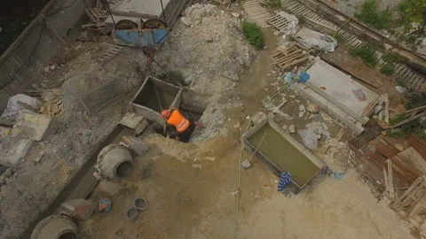 Builders working at construction building site. Aerial view Stock Footage 158791360