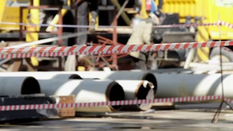 Builders working on the construction near barrier tape Stock-Footage 75228082