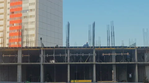 Builders working on the construction of a residential building, timelapse Stock Footage 129716631