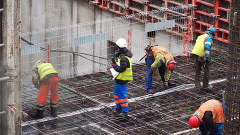 Builders working on a construction site 스톡 동영상 105682880