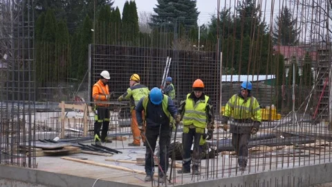 Builders working at the construction site . Warsaw - November - 2020 Stock Footage 146790965