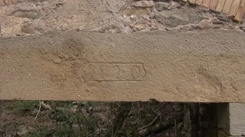 Building abandoned old stone 1820 inscription engraving year date door ruin Stock Footage 330471456