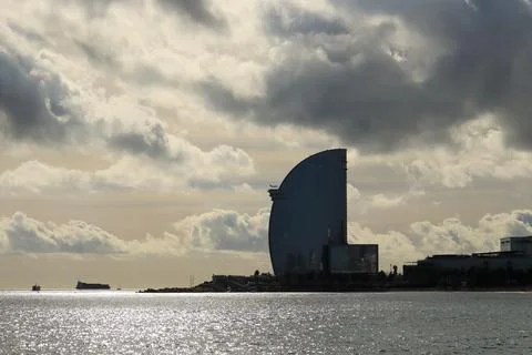 The building against the background of the cloudy sky - Barcelona Stock Photos