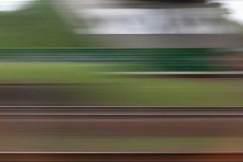 A building and abstract pattern in blurred motion viewed from moving train Stock Photos