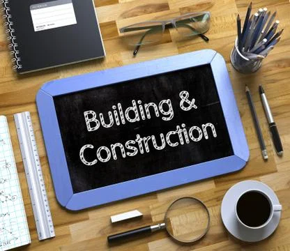 Building and Construction - Text on Small Chalkboard. 3D Ilustración de archivo