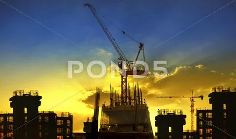 Building and crane construction site against beautiful dramatic in dusky sky Stock Photos