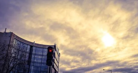 Building anf traffic lights in winter against dark sky Stock Photos