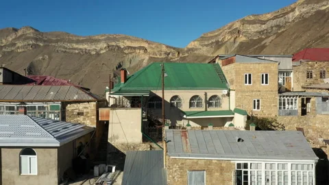 Building with arch windows and green roof in Chokh village Stock Footage 145333301