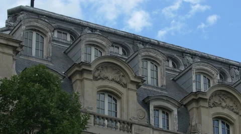 Building with attic windows on a street in Paris Stock-Footage 59974368