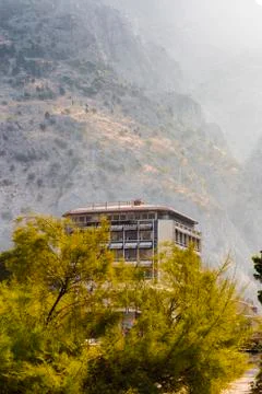A building on the background of a mountain Stock Photos