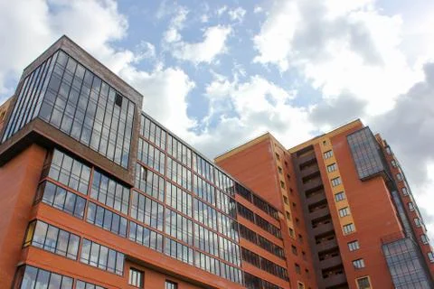 Building on background sky with clouds. .against the sky a new high-rise buil Stock Photos